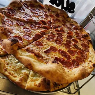 Signature Italian,Pizza delicacies handcrafted by Tonti's Pizzeria expert chefs.