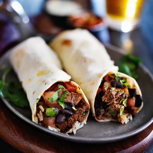 Signature Burritos,Mexican,Tacos delicacies handcrafted by El Nuevo Cinco De Mayo expert chefs.