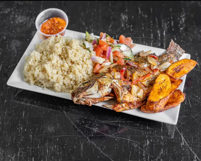 Atieke with baked or fried tilapia fish
