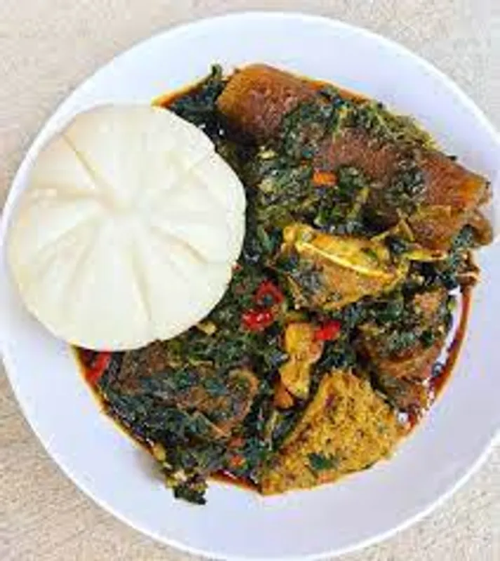 Vegetables and Pounded Yam serves with chicken& beef