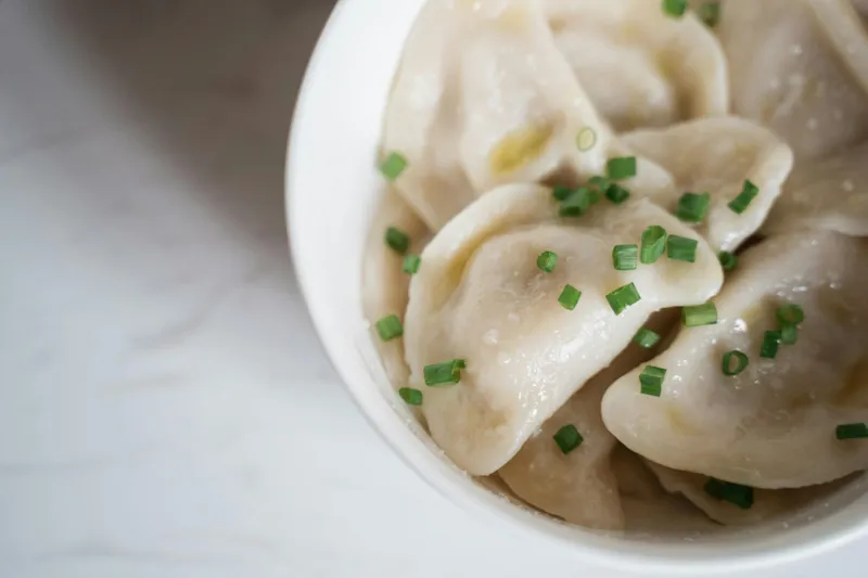 The dough is rolled into small circular flat pieces with the filling enclosed in a round pocket or crescent shape. People prefer meat with a lot of fat for juicy, flavorful momos. Sometimes, oil is added to lean meat to keep the filling moist