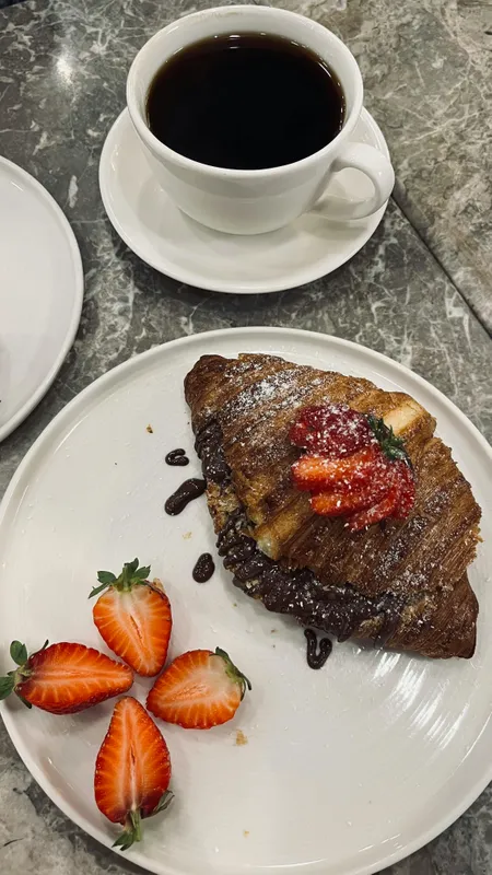 Karimeen fish, also known as Pearl Spot, is a popular delicacy in Kerala cuisine. It has a tender, flavorful meat and is often cooked in traditional styles like frying or steaming with spices