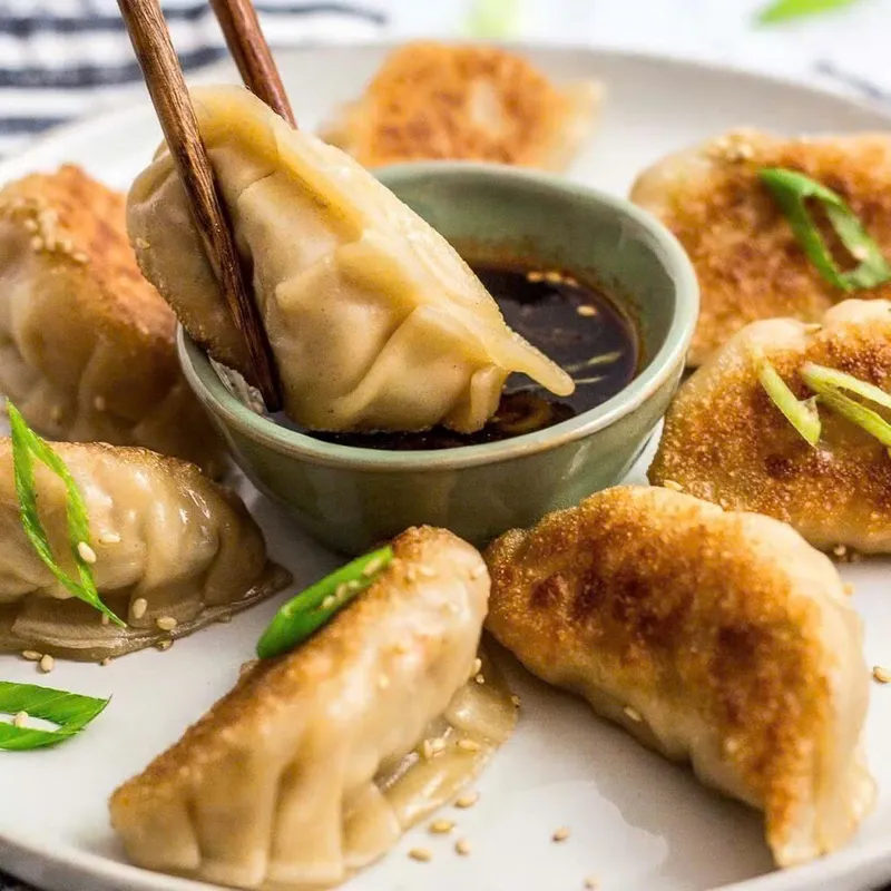 A12. Pan Fried Pork Dumpling ( 6 pcs)