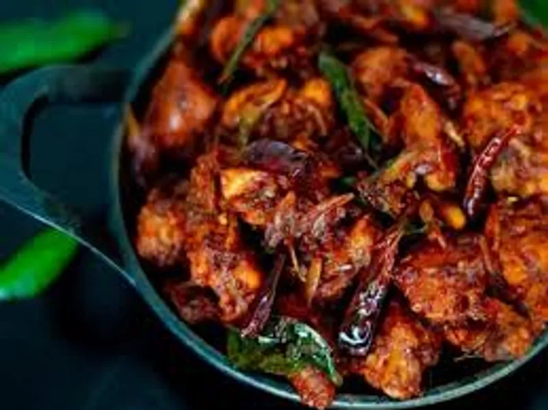 chicken kondattam in keral style with crispy onions and juicy fried chciken pieces that can server 2 person, in addition with salads and dips each mint and lemon flavoured