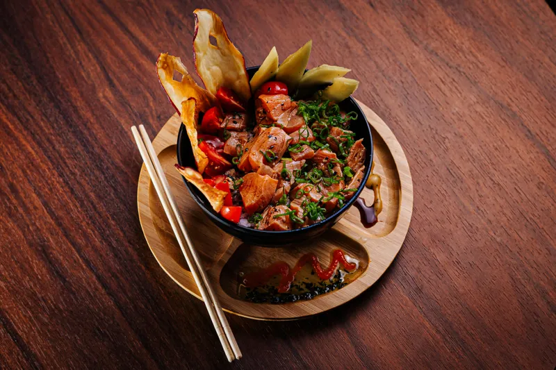 Spicy shredded chicken noodles in chili oil with sesame sauce and crushed peanuts