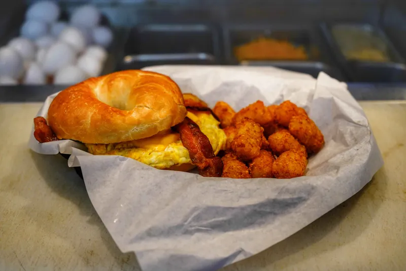 Scrambled Eggs With Cheese On Bagel