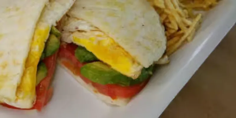 Fries Eggs, Tomatoes And Avocado