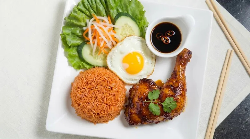 92. Half Rotisserie Chicken With Red Rice