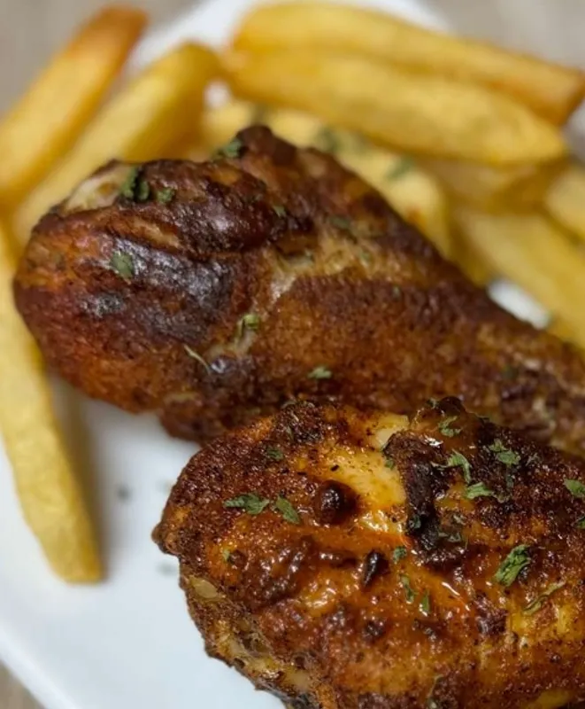 two drumstick chicken with fries