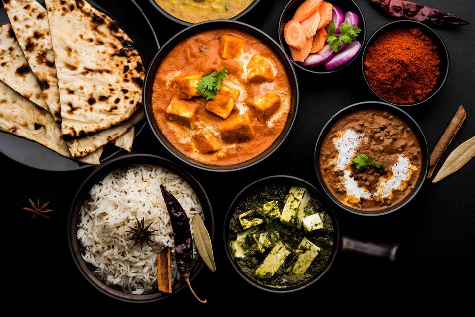 Our kitchen team preparing fresh dishes at India Market - Demo