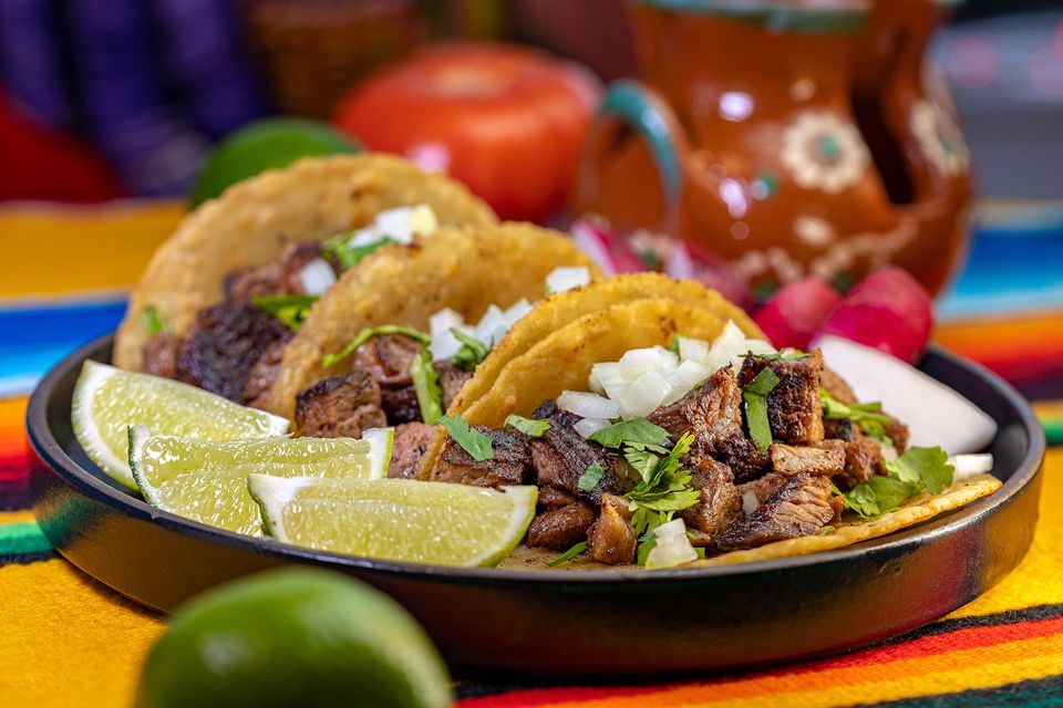 Our kitchen team preparing fresh dishes at Julians Taco Shop
