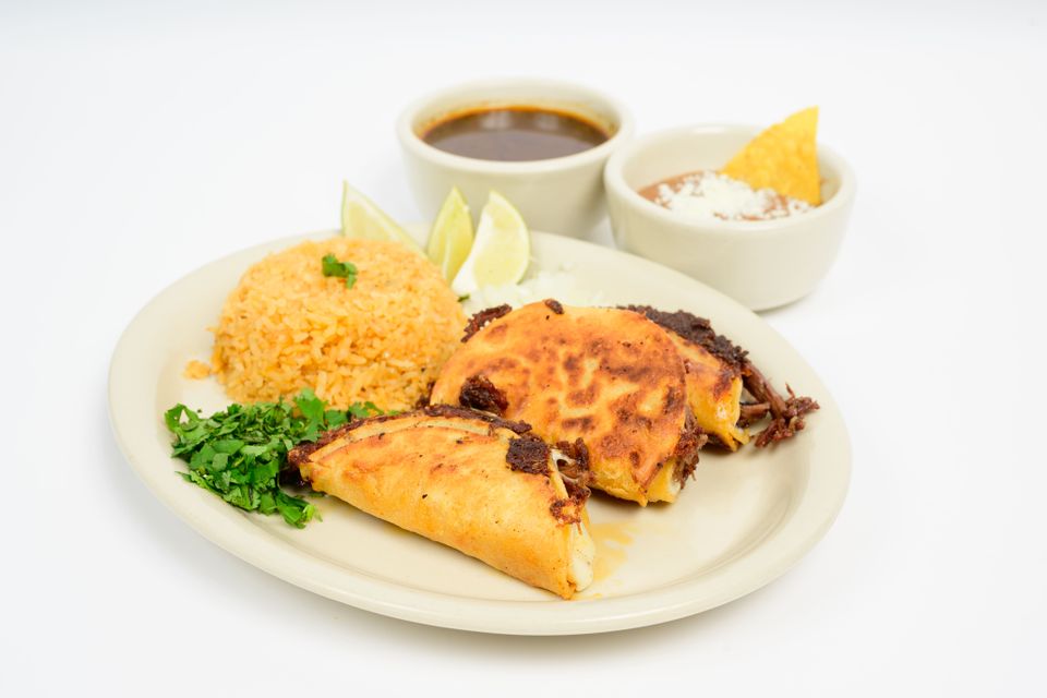 Our kitchen team preparing fresh dishes at Taco Master Grill