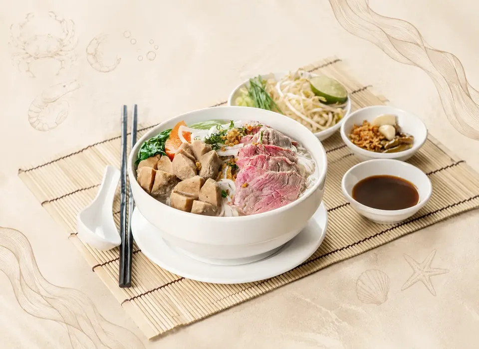 Our kitchen team preparing fresh dishes at Pho & Seafood