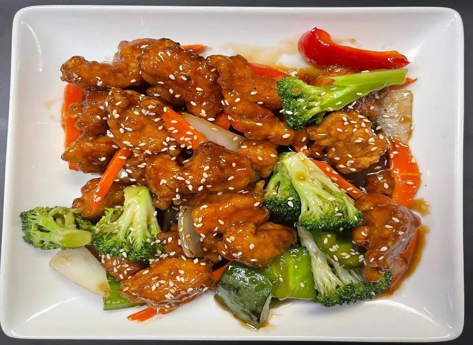 Our kitchen team preparing fresh dishes at Lovy Thai Cuisine