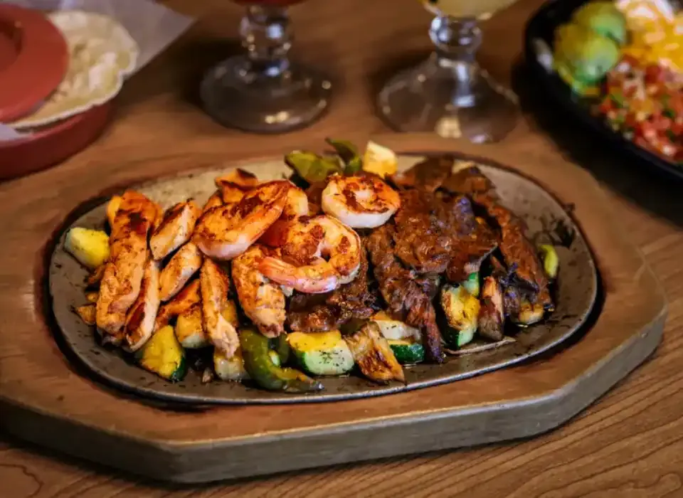 Our kitchen team preparing fresh dishes at Los Jalapenos