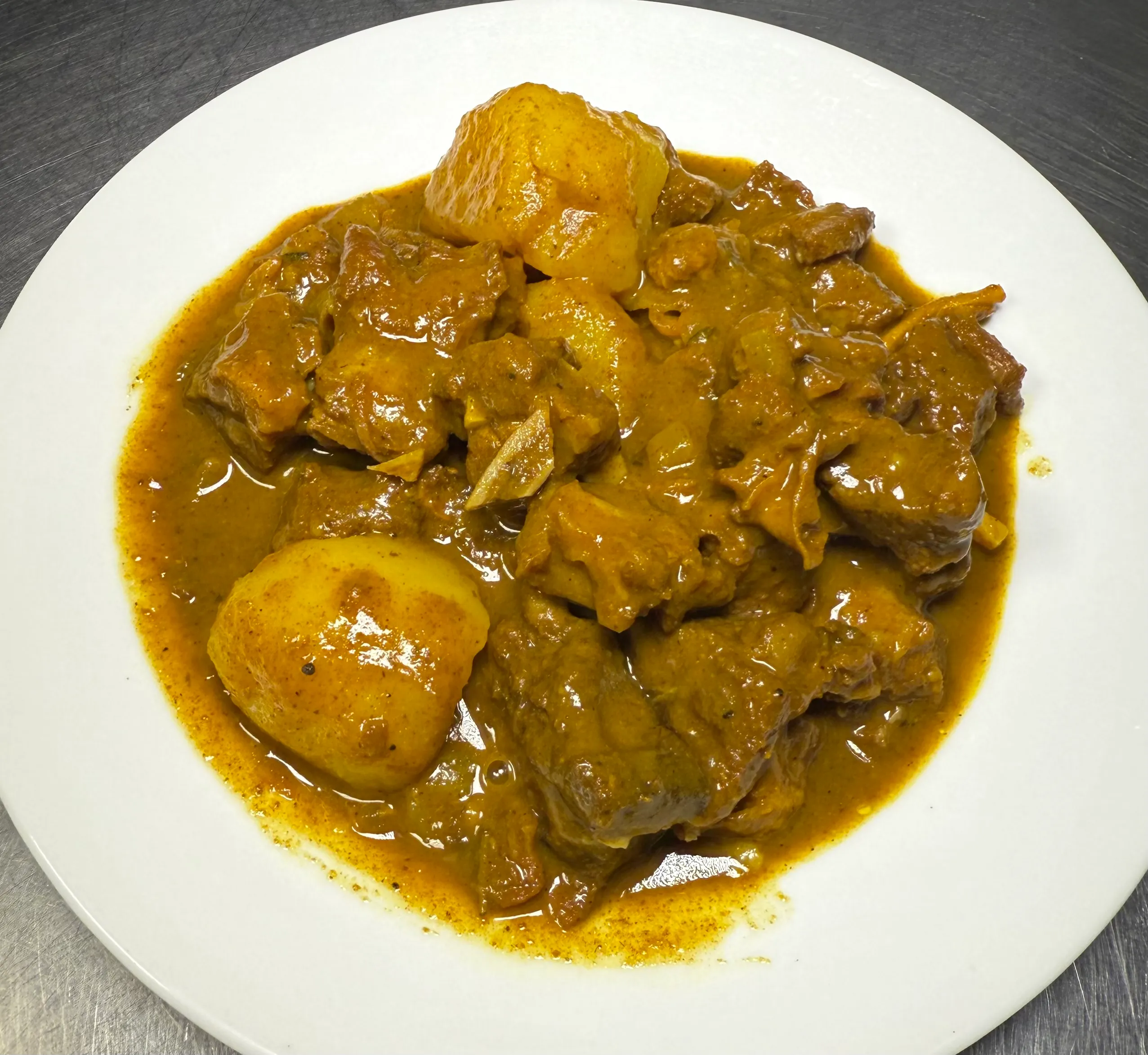 Plated Caribbean food - Trusted local Caribbean dining at Yaadman Kitchen Jamaican Restaurant.